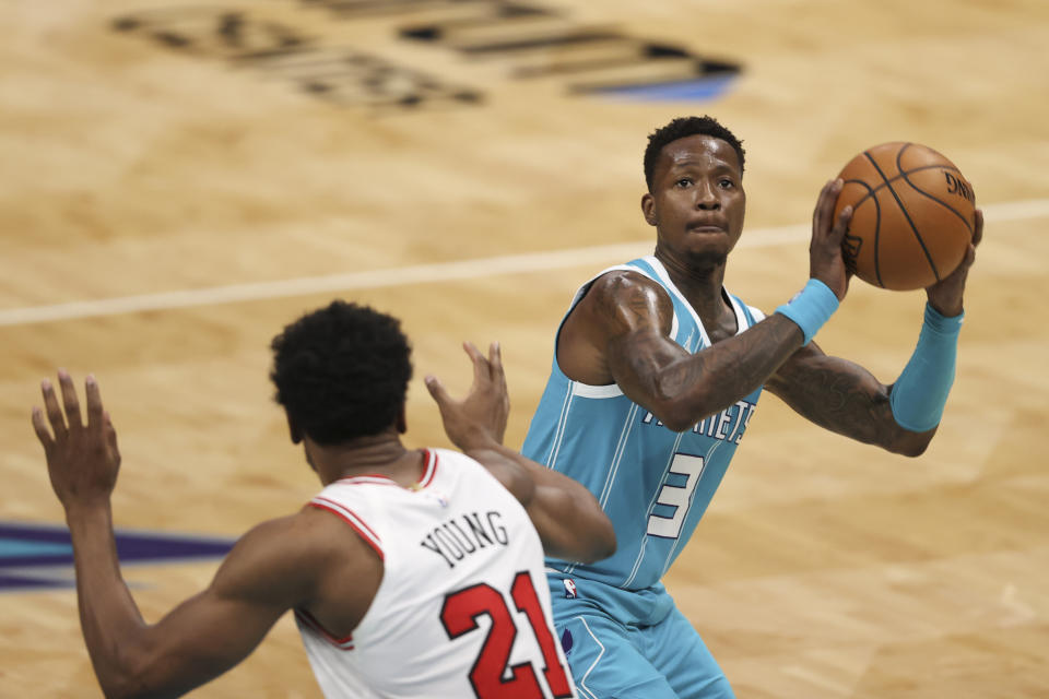 Charlotte Hornets guard Terry Rozier (3) shoots as Chicago Bulls forward Thaddeus Young (21) defends during the first half of an NBA basketball game in Charlotte, N.C., Thursday, May 6, 2021. (AP Photo/Nell Redmond)