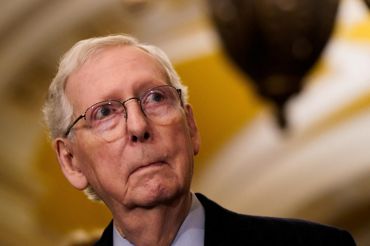 Senate Minority Leader Mitch McConnell listens to a question from a reporter following a meeting at the White House on February 27.