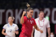 Norway's Nora Moerk celebrates during the women's semifinal handball match between Norway and Russian Olympic Committee at the 2020 Summer Olympics, Friday, Aug. 6, 2021, in Tokyo, Japan. (AP Photo/Pavel Golovkin)