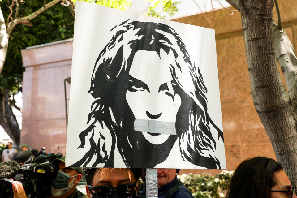 LOS ANGELES, CALIFORNIA - JUNE 23: #FreeBritney activists protest at Los Angeles Grand Park during a conservatorship hearing for Britney Spears on June 23, 2021 in Los Angeles, California. Spears is expected to address the court remotely. Spears was placed in a conservatorship managed by her father, Jamie Spears, and an attorney, which controls her assets and business dealings, following her involuntary hospitalization for mental care in 2008. (Photo by Rich Fury/Getty Images)