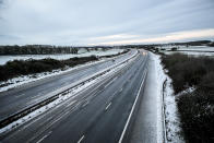 <p>Snow reduces the M5 motorway down to two lanes between junction 14 and 15 in South Gloucestershire after overnight snow has caused travel disruptions across parts of the UK. (PA) </p>