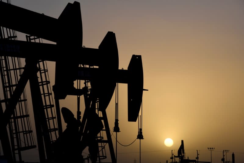 FILE PHOTO: Pump jacks operate at sunset in Midland