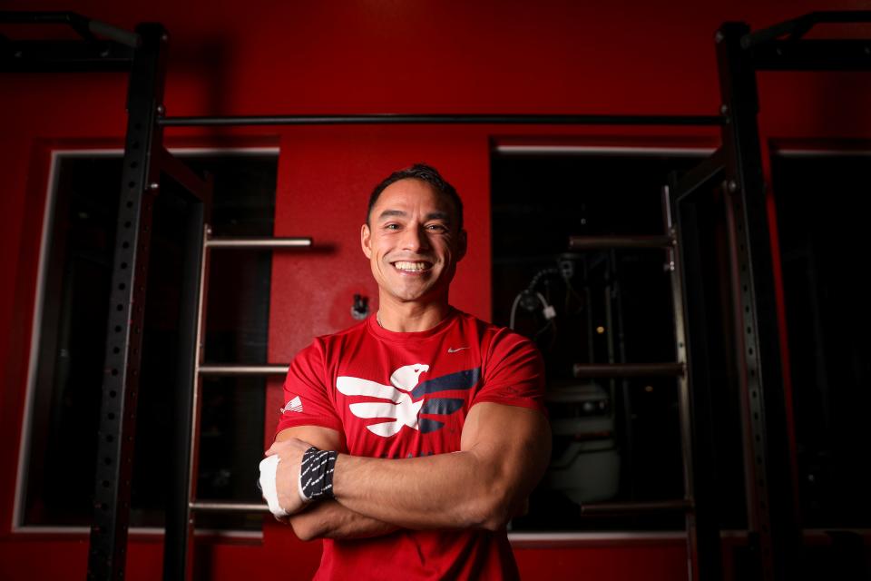 Tommy Vu sets the world record for completing 611 burpee pull-ups in one hour on Monday, Dec. 11, 2023 at West Coast Strength in West Salem, Ore.