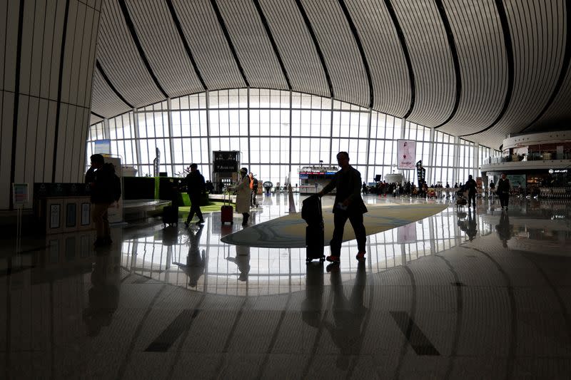 FILE PHOTO: Travellers at Beijing Daxing International Airport