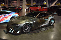 <p>The intricate wrap on this Supra is described as, “a fusion of baroque architectural styling with samurai yoroi/oni mask design,” by the designer and owner, known on Instagram as The Black GT. They also penned the custom aero kit that was built by Galvez Customs. Reflective accents illuminate under light.</p>