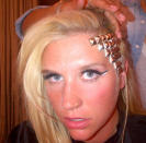 Celebrity photos: Singer Ke$ha has gone for a new hair ‘do – studs on her hairline. We don’t think that this particular look is going to take off.