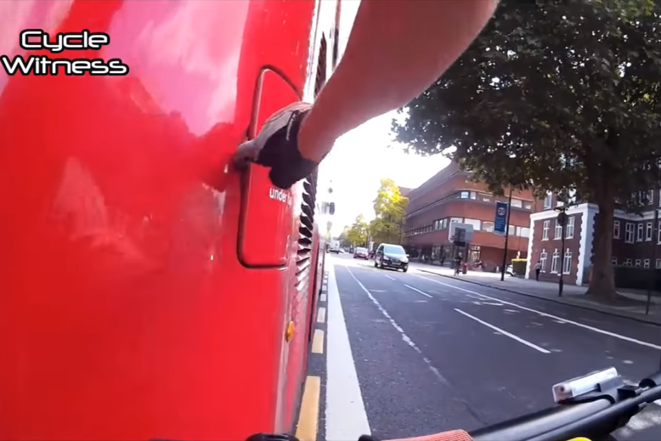 The flap at the back of the bus was opened by the cyclist, who hit the emergency engine cut-off button (YouTube/Cycle Witness)