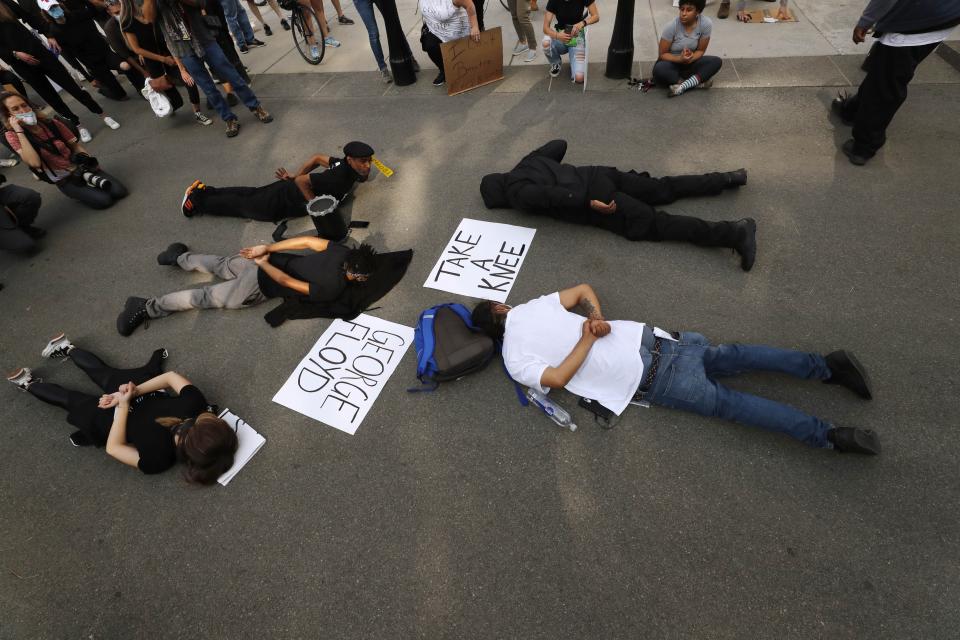 Demonstrators lie face down depicting George Floyd during his detention by police during a protest against police brutality on Boston Common, Wednesday, June 3, 2020. Floyd died after being restrained by Minneapolis police officers on May 25. (AP Photo/Charles Krupa)