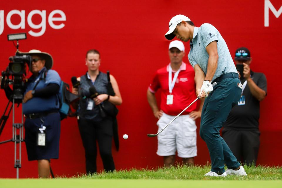 Collin Morikawa chips at hole 18 of the playoffs after the regulation game he Rocket Mortgage Classic at Detroit Golf Club on Sunday, July 2, 2023. 