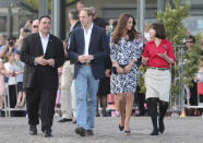 Britain's Prince William, center left, and his wife Kate, the Duchess of Cambridge , center right, walk with Randall Walker, left, chief executive officer of Blue Mountains Lithgow and Oberon Tourism and Anthea Hammon, joint managing director of Scenic World the Echo Point Lookout at in Katoomba, Australia, Thursday, April 17, 2014. The Duke and Duchess of Cambridge on Thursday stopped in the Blue Mountains town of Winmalee to meet with firefighters and locals affected by last year's wildfires that destroyed more than 200 homes. (AP Photo/Rob Griffith)