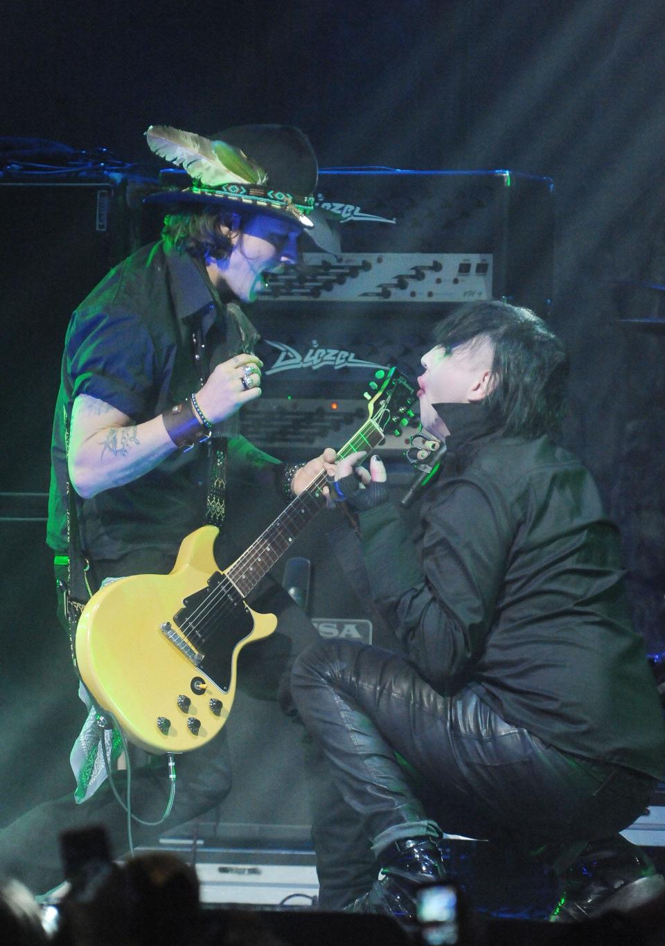 Johnny Depp (left) and Marilyn Manson perform live at the 4th annual Revolver Golden Gods Award Show, Wednesday, April 11, 2012, at Club Nokia in Los Angeles.