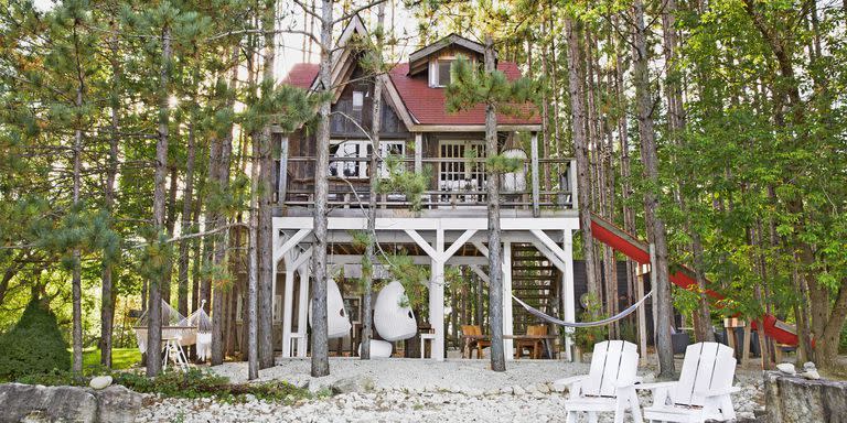<p>Inside this treehouse-inspired tiny cabin, you'll find salvaged church windows, reclaimed wood, and a funky dining table set crafted from old boats. </p><p><a class="link " href="https://www.countryliving.com/home-design/house-tours/g20876637/canadian-tiny-house-cabin/" rel="nofollow noopener" target="_blank" data-ylk="slk:SEE INSIDE;elm:context_link;itc:0;sec:content-canvas">SEE INSIDE</a></p>