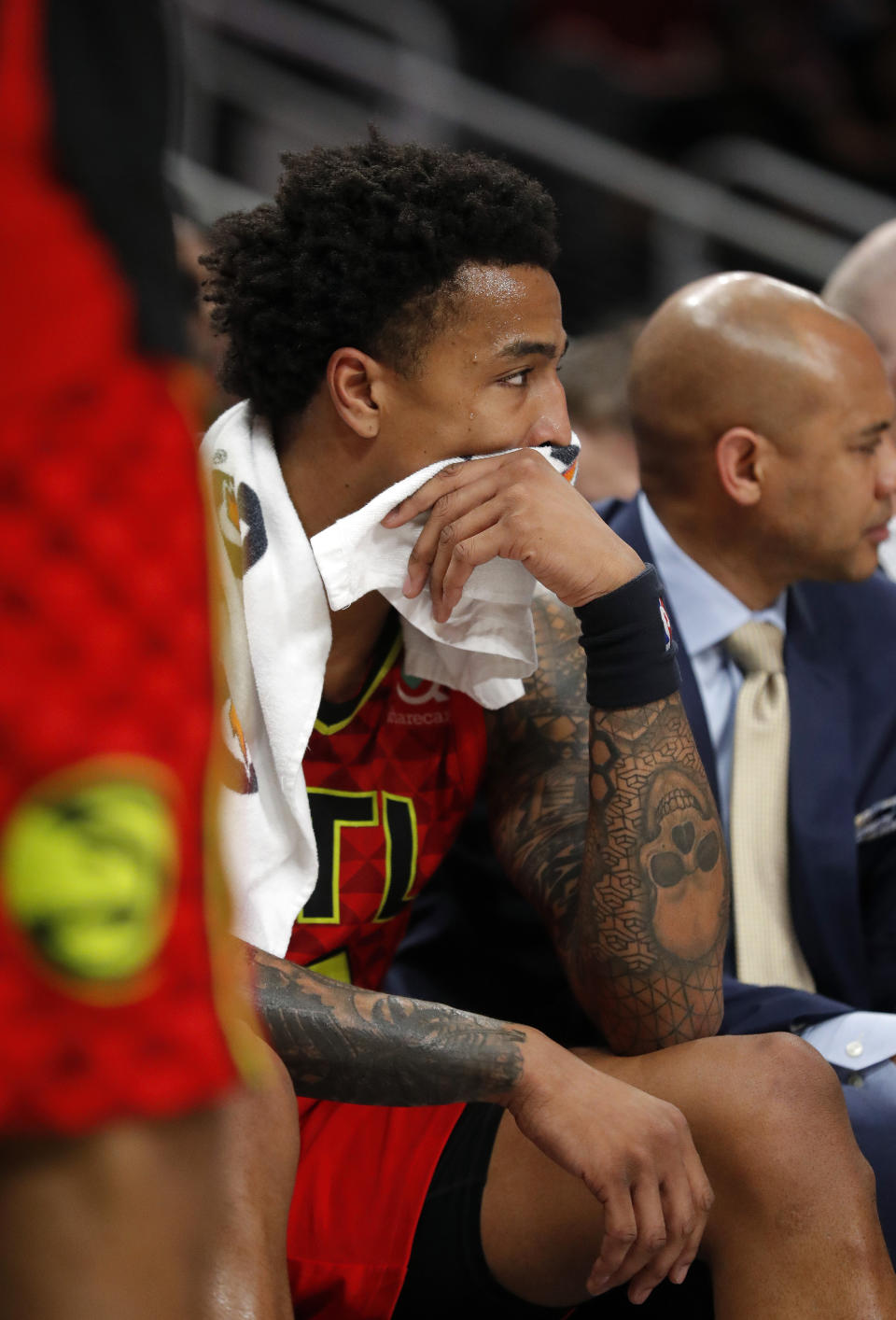 Atlanta Hawks forward John Collins sits on the bench at the end of the team's 106-91 loss to the New York Knicks in an NBA basketball game Thursday, Feb. 14, 2019, in Atlanta. (AP Photo/John Bazemore)