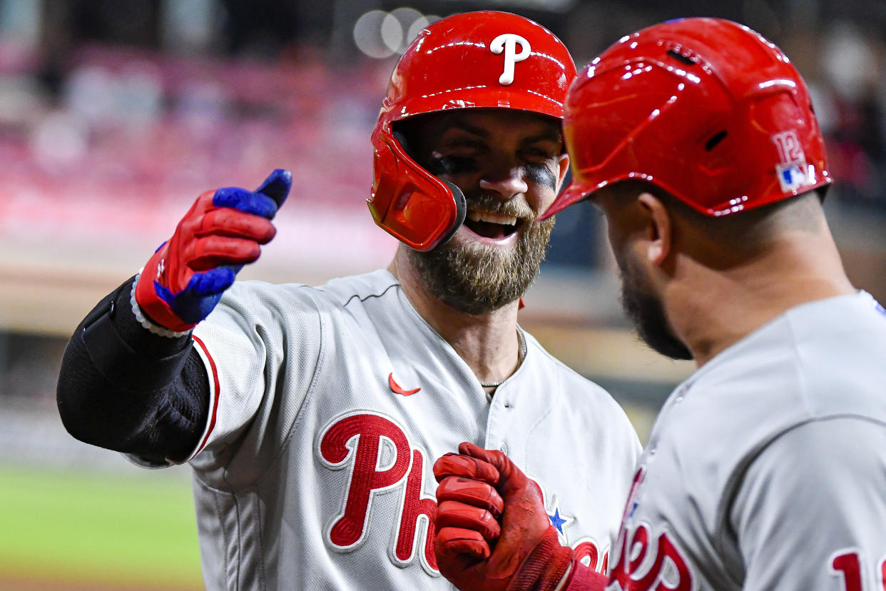 Bryce Harper, seen here celebrating a hit with Kyle Schwarber, is leading the Phillies into the World Series against the Astros. (Photo by Logan Riely/Getty Images)