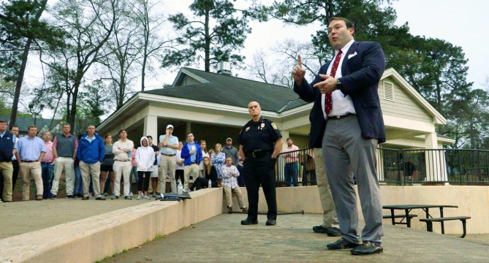 Columbus City Councilor Walker Garrett, right, speaks March 2 during a meeting at Lakebottom Park in Columbus, called to address crime and crime prevention measures.