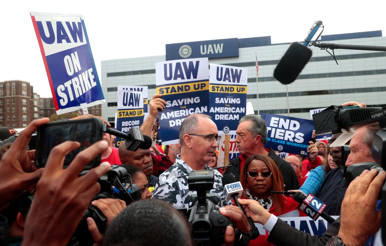 UAW president Shawn Fain talks with the media after his speech to striking workers from the bed of a Ford F-150 at the UAW Solidarity House on Jefferson Avenue in Detroit on Friday, September 29, 2023. Many of the workers caravanned in Ford Broncos and Jeeps to hear him speak.