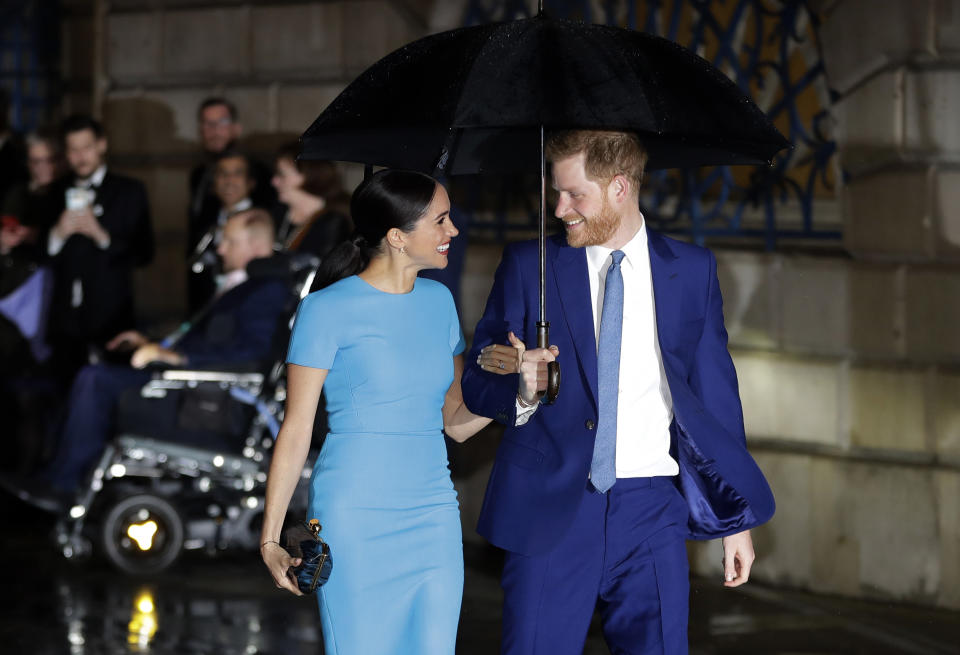 FILE - In this Thursday, March 5, 2020 file photo, Britain's Prince Harry and Meghan, the Duke and Duchess of Sussex arrive at the annual Endeavour Fund Awards in London. Prince Harry and his wife, Meghan, are fulfilling their last royal commitment Monday March 9, 2020 when they appear at the annual Commonwealth Service at Westminster Abbey. It is the last time they will be seen at work with the entire Windsor clan before they fly off into self-imposed exile in North America. (AP Photo/Kirsty Wigglesworth, file)