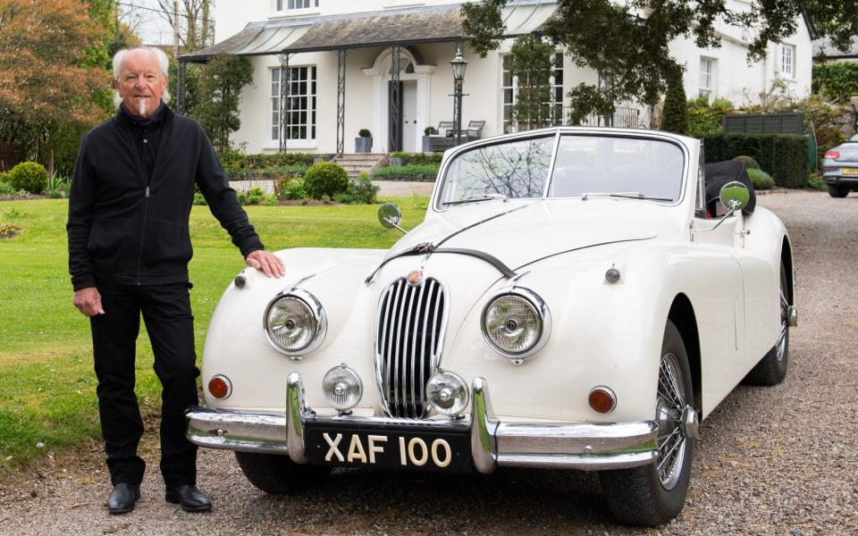 Musician Martin Barre a former member of Jethro Tull with his Jaguar XK140 at his home in Devon