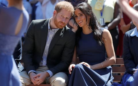 Prince Harry, Duke of Sussex and Meghan, Duchess of Sussex watch a performance during their visit to Macarthur Girls High School - Credit: Phil Noble/Getty