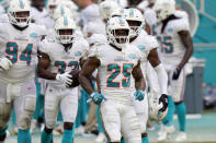 FILE - In this Oct. 18, 2020, file photo, Miami Dolphins cornerback Xavien Howard (25) celebrates after intercepting a pass during the first half of an NFL football game against the New York Jets in Miami Gardens, Fla. The Dolphins' run defense makes even Sunday's matchup against the New York Jets potentially problematic. The Jets are 0-10 and lost 24-0 at Miami in Week 6, but they’re averaging a respectable 4.2 yards per carry and are sure to test the Dolphins' weakness. (AP Photo/Lynne Sladky, File)