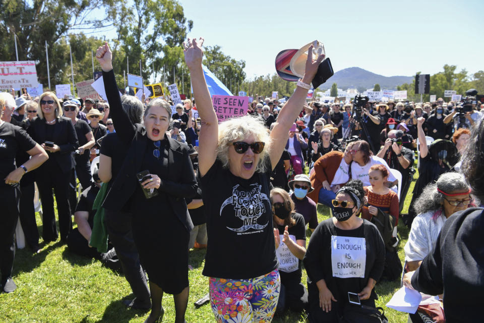 Protesters cheer during the Women's March 4 Justice in Canberra, Australia, Monday, March 15, 2021. The rally was one of several across Australia including in Sydney, Melbourne, Brisbane and Hobart calling out sexism, misogyny and dangerous workplace cultures. (Mick Tsikas/AAP Image via AP)