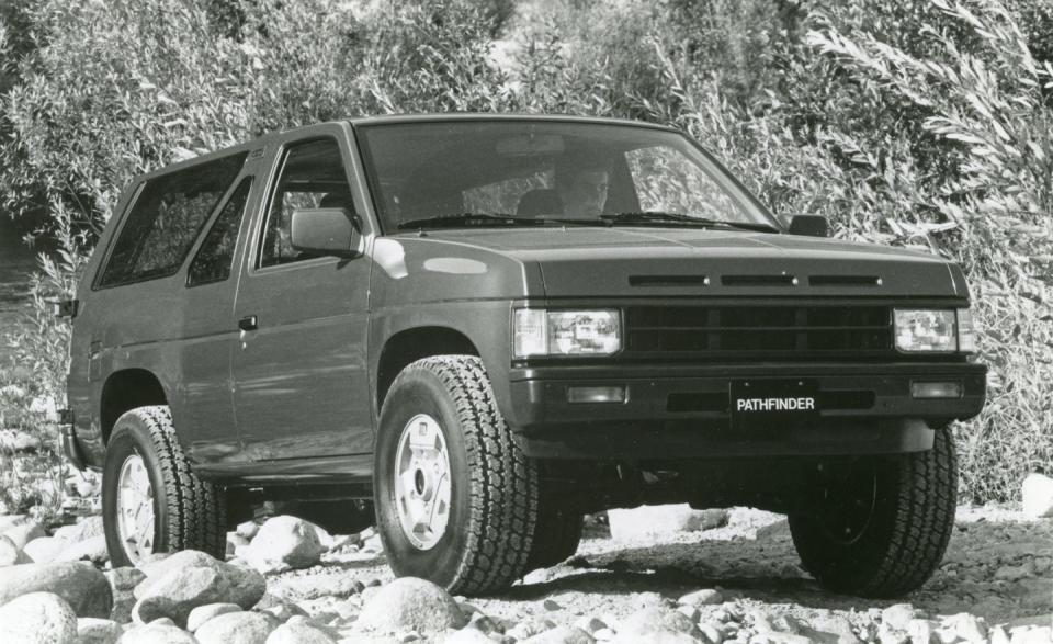 <p>The two-door model used a fixed steel roof, and designers gave it a cool triangular side window glass treatment. As a practical hauler, the Pathfinder could swallow a four foot-by-eight foot sheet of plywood. The insulated steel roof helped make this Nissan quieter and more refined than the Toyota 4Runner. In 1990, the V-6 got stronger (153 horsepower) and Nissan added a four-door version that cleverly hid the passenger door handles and used the same chassis. It proved so popular that Nissan dropped the two-door in 1991. The Pathfinder became more luxurious with age, adding a fancy LE grade and a new interior in 1994, just one year before it was replaced.</p>