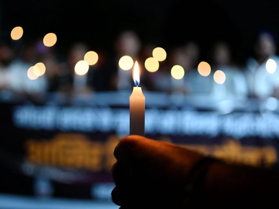 Members of India's Youth Congress take part in a candlelight march in New Delhi