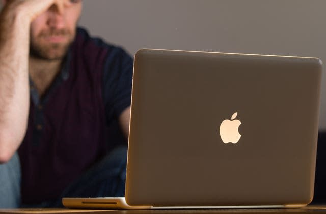 A man using a laptop