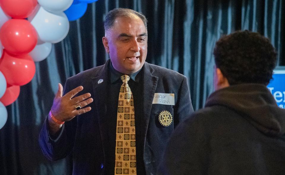 Stockton City Council candidate Waqar Rizvi talks with supporters at Jerry McNerney's election watch party at Valley brew in Stockton for the 2024 California Primary Election on Mar. 5, 2024.