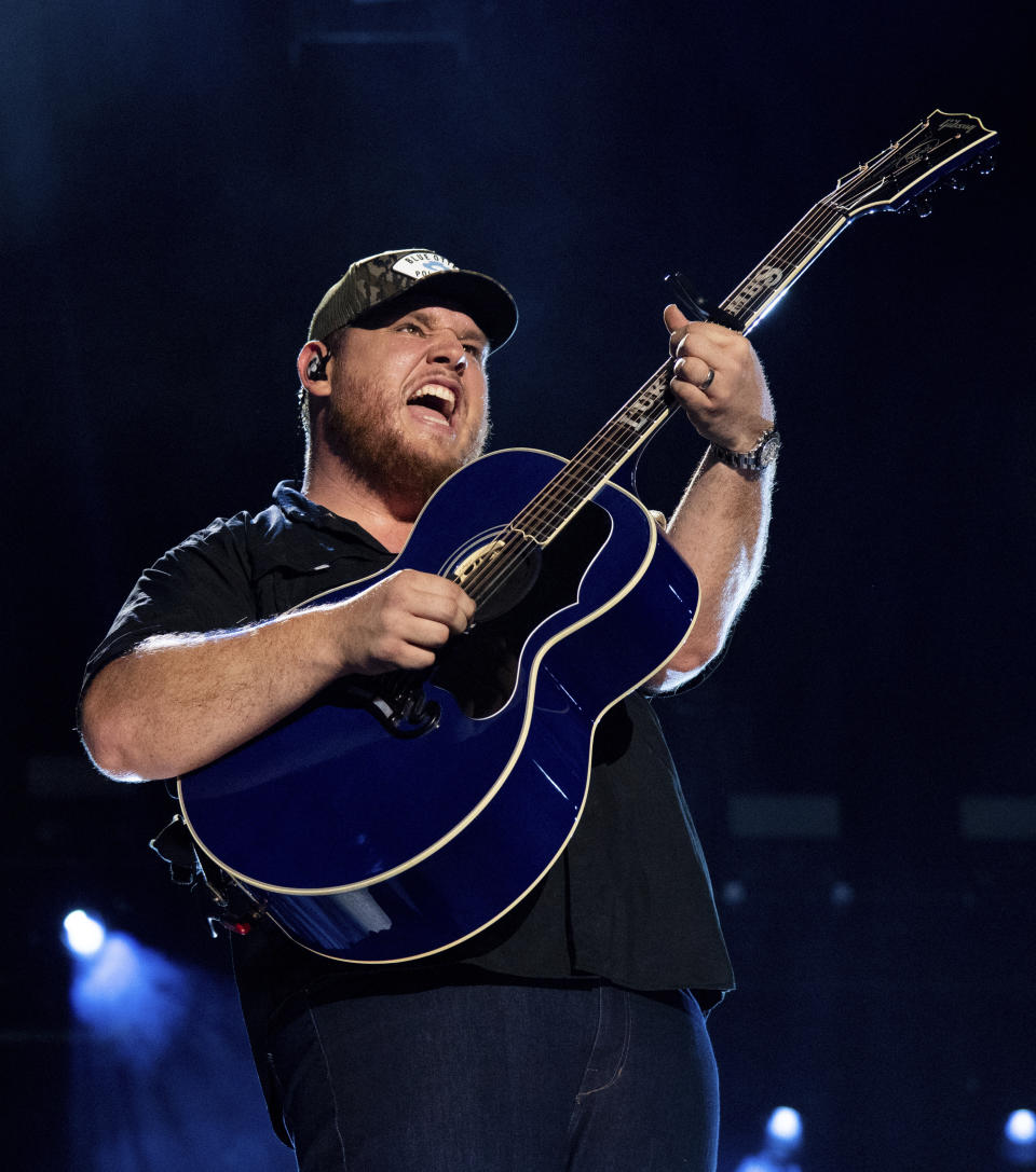 FILE - Luke Combs performs during CMA Fest 2022 in Nashville, Tenn., on June 11, 2022. Comb's latest album, "Growin' Up," releases Friday, July 1. (Photo by Amy Harris/Invision/AP, File)