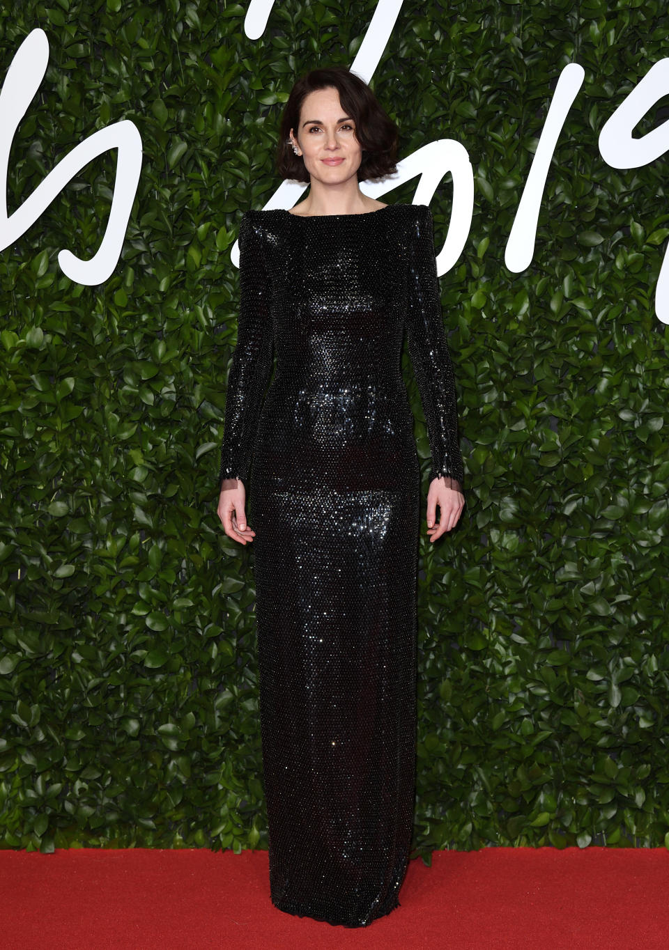 Michelle Dockery added subtle sparkle in this floor length gown [Photo: Getty]