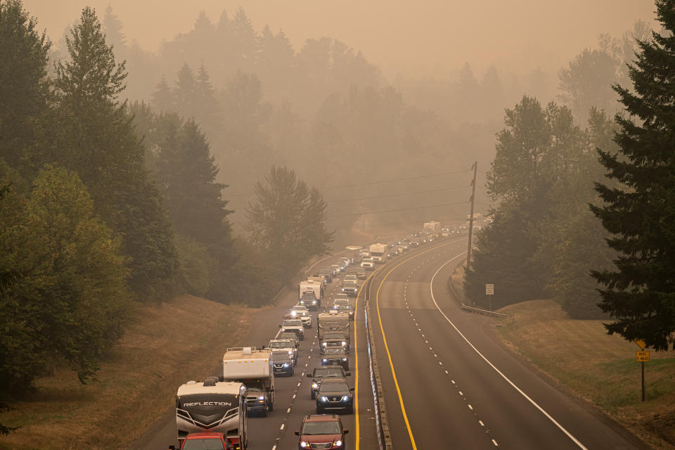 Oregon residents evacuate north along highway Highway 213 on Sept. 9 near Oregon City, Oregon. Multiple wildfires grew by hundreds of thousands of acres Thursday, prompting large-scale evacuations throughout the state. (Photo: Nathan Howard via Getty Images)