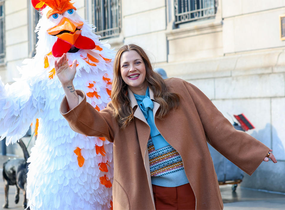 <p>Drew Barrymore films with a giant feathery friend in N.Y.C. on Jan. 7. </p>