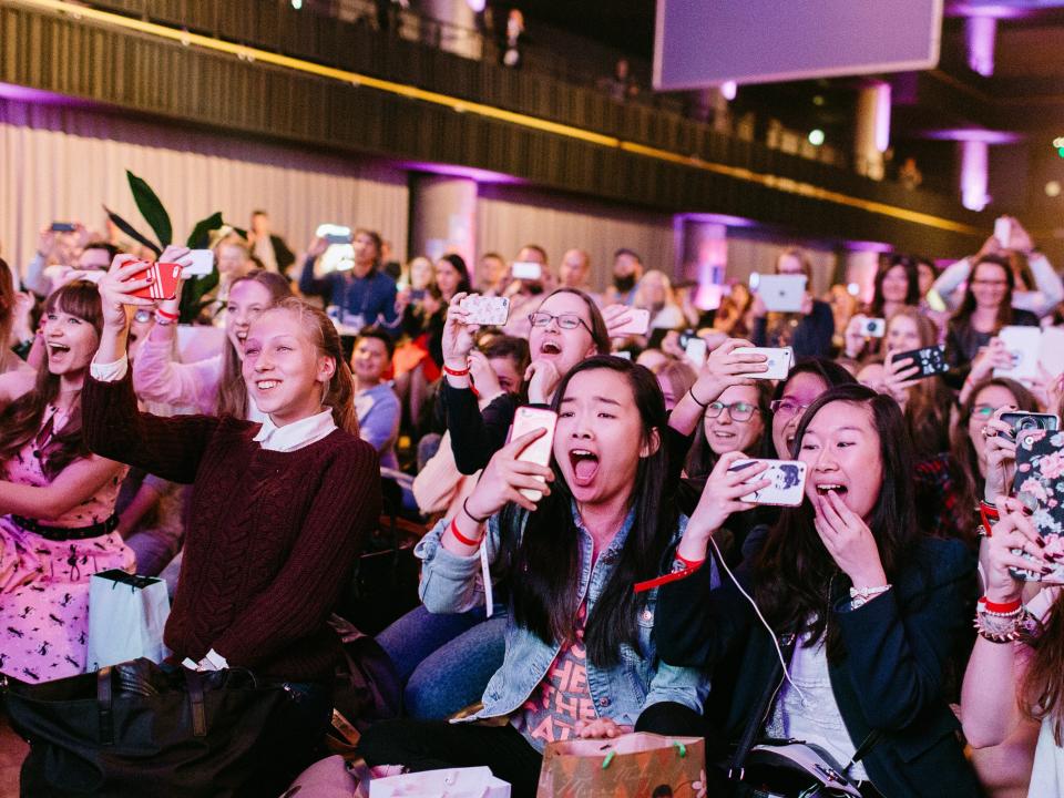 Crowd surprise phones cameras shock audience