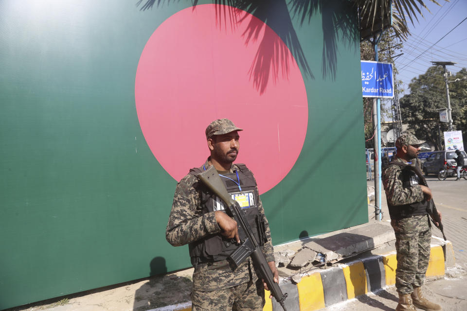 Security personnel stand guard outside the Gaddafi Stadium in Lahore, Pakistan, Friday, Jan. 24, 2020. Pakistan and Bangladesh play their first T20 of the three matches series under tight security. (AP Photo/K.M. Chaudary)