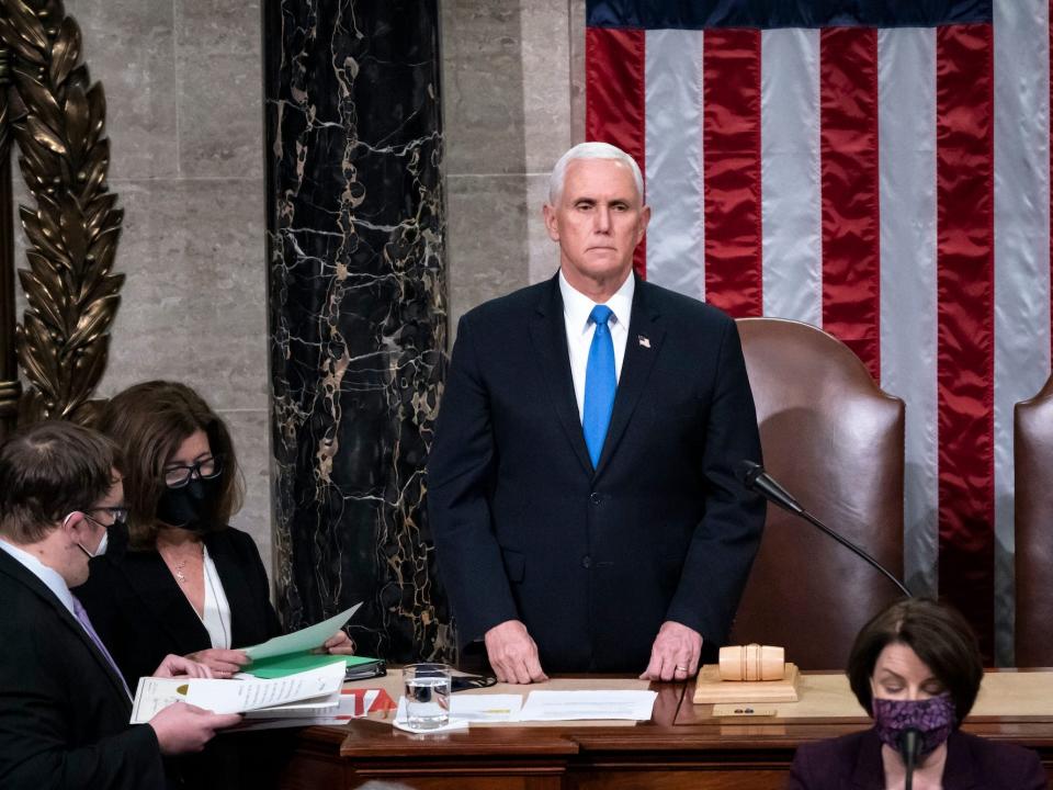 Vice President Mike Pence returns to the House chamber after midnight, Jan. 7, 2021, to finish the work of the Electoral College after a mob loyal to President Donald Trump stormed the Capitol in Washington and disrupted the process.