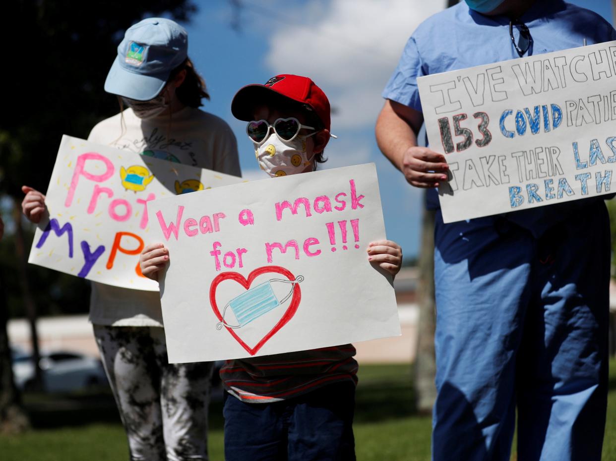 A doctor was let go by the medical facility that he worked at after it was discovered he was charging people $50 for mask exemption letters  (REUTERS)