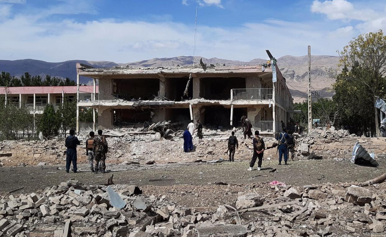 <span class="caption">Afghan security personnel inspect the rubble of Afghanistan's intelligence services building after a car bomb blast claimed by the Taliban killed at least 11 people, July 13, 2020. </span> <span class="attribution"><a class="link " href="https://www.gettyimages.com/detail/news-photo/afghan-security-personnel-inspect-the-site-of-a-car-bomb-news-photo/1226604830?adppopup=true" rel="nofollow noopener" target="_blank" data-ylk="slk:AFP via Getty Images;elm:context_link;itc:0;sec:content-canvas">AFP via Getty Images</a></span>