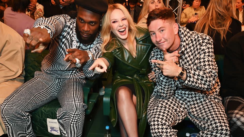 UK rapper Burna Boy, Kylie Minogue and "The Banshees of Inisherin" actor Barry Keoghan spotted front row at the Burberry show. - Dave Benett/Courtesy Burberry