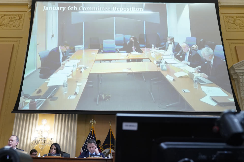 A video of a deposition of Jeffrey Clark is displayed as the House select committee investigating the Jan. 6 attack on the U.S. Capitol continues to reveal its findings of a year-long investigation, at the Capitol in Washington, Thursday, June 23, 2022. (AP Photo/Jacquelyn Martin)