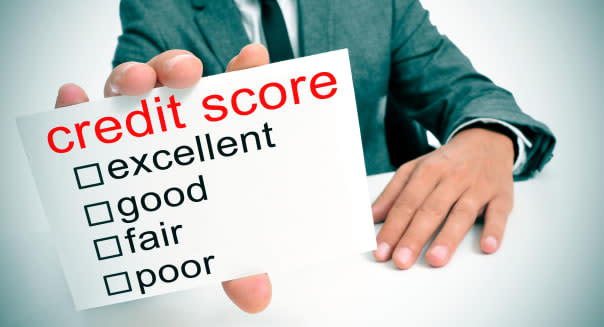 man in suit showing a signboard with the different ranges of the credit score: excellent, good, fair and poor