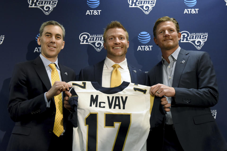 On Friday, the Los Angeles Rams announced contract extensions for head coach Sean McVay, center, and general manager Les Snead, right. (AP)   