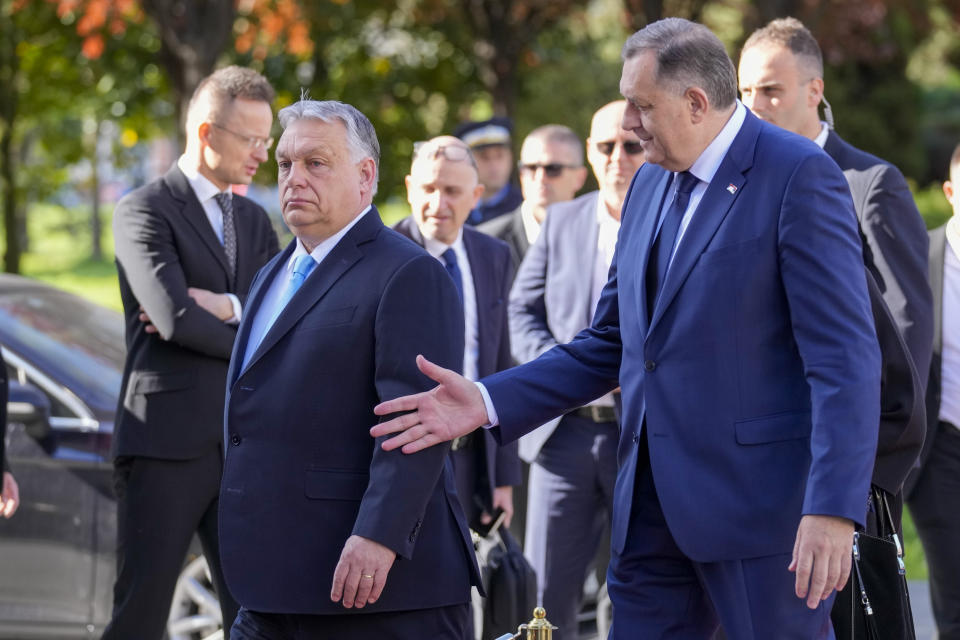 Bosnian Serb leader Milorad Dodik, right, welcomes Hungary's Prime Minister Viktor Orban, in Banja Luka, Bosnia, Friday, April 5, 2024. (AP Photo/Darko Bandic)