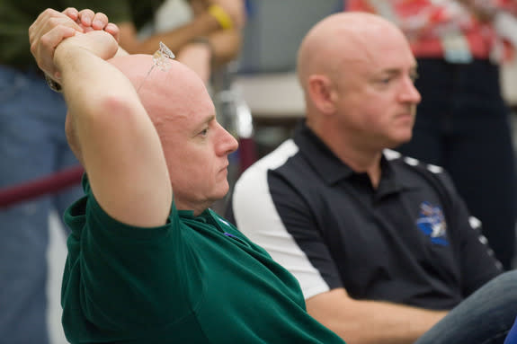 NASA Astronauts Mark Kelly and Scott Kelly, identical twins, are pictured participating in the Joint STS-134, Expedition 25 and Expedition 26 International Space Station Emergency Scenario training. At the time, both Kelly brothers planned to b