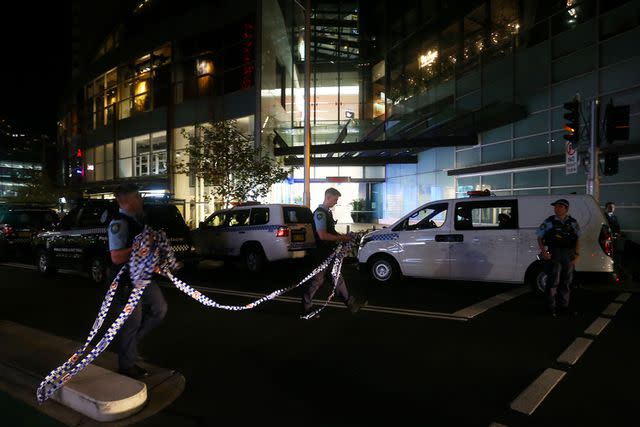 <p>Lisa Maree Williams/Getty </p> NSW police vehicles arrive at Westfield Bondi Junction on April 13