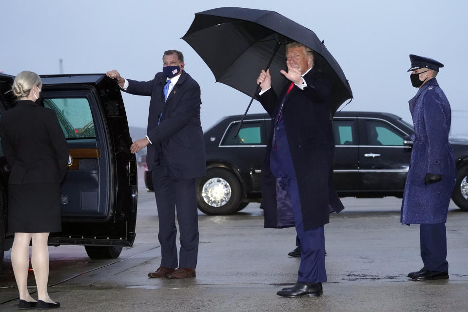 President Donald Trump waves as he steps off Air Force One upon arrival Sunday, Oct. 25, 2020, at Andrews Air Force Base, Md. Trump is returning from New Hampshire and Maine. (AP Photo/Alex Brandon)