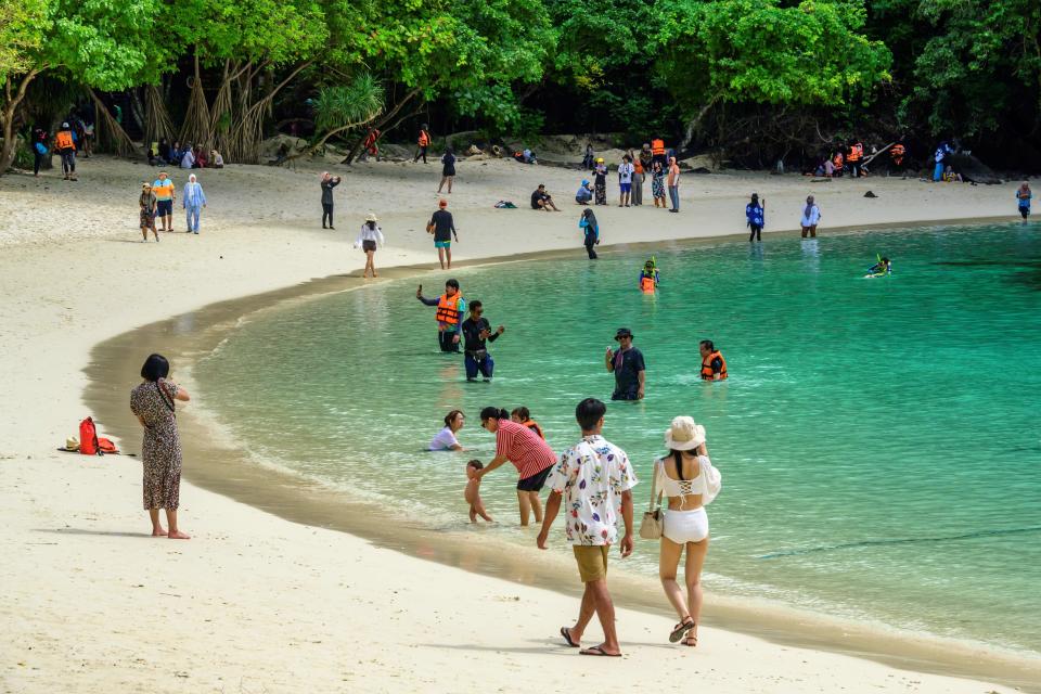 This photograph taken on November 25, 2020 shows local tourists enjoying the beach of one of Thailand's Koh Hong islands