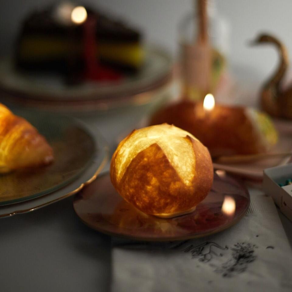 It's a roll that won't roll away from them. This lamp doesn't just look like a dinner roll &mdash; it's made from a <i>real</i> roll that's been preserved in resin and retrofitted to light up. They'll want to show it off on Zoom calls. ﻿<a href="https://fave.co/30xQOJB" target="_blank" rel="noopener noreferrer">Find it for $75 at Catbird</a>.
