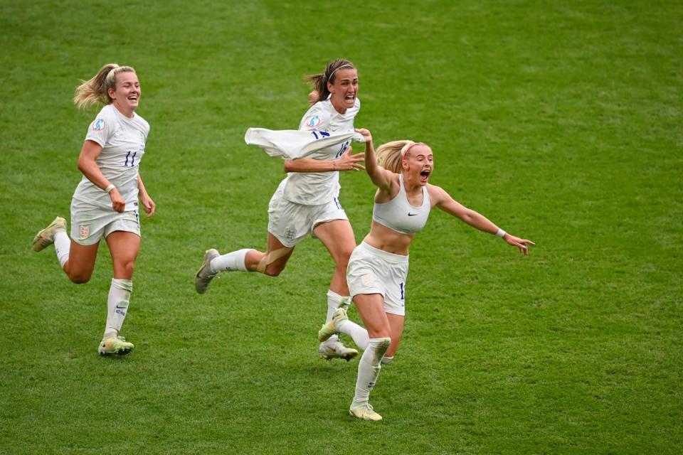 Chloe Kelly celebrates scoring the winning goal with England teammates Lauren Hemp and Jill Scott during the Uefa Women’s Euro 2022 final at Wembley (Getty)