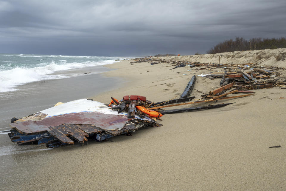 Debris washed ashore by sea at a beach near Cutro, southern Italy, Monday, Feb. 27, 2023. Nearly 70 people died in last week's shipwreck on Italy's Calabrian coast. The tragedy highlighted a lesser-known migration route from Turkey to Italy for which smugglers charge around 8,000 euros per person. (Giovanni Isolino/LaPresse via AP, File)